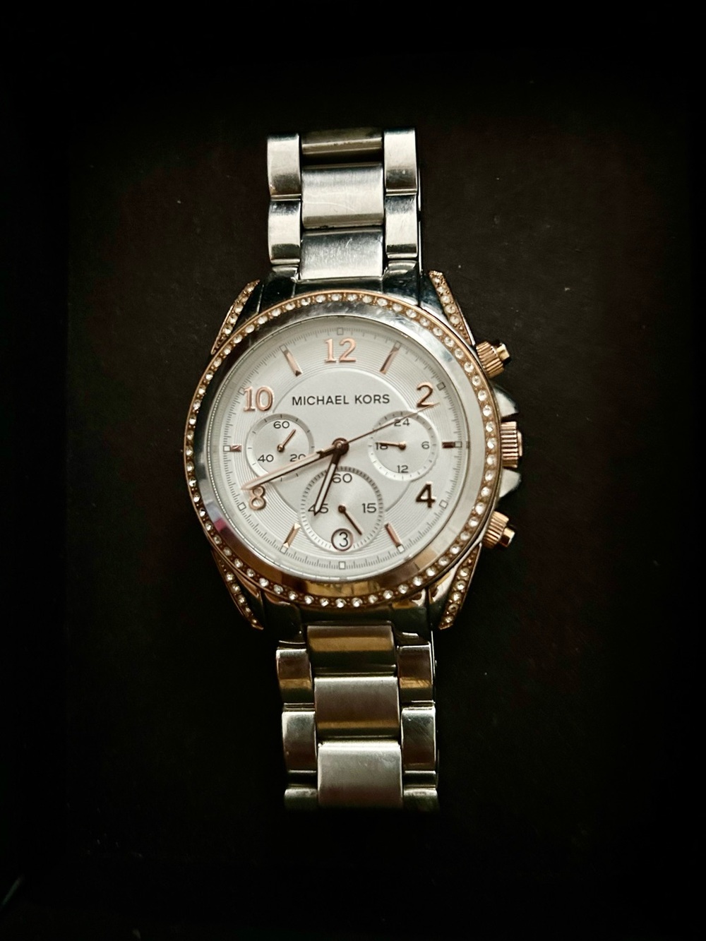Michael Kors Two-Tone Silver and Rose Gold Chronograph Watch with Crystal Bezel.